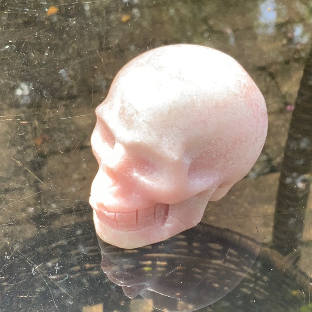 PINK QUARTZITE HAND CARVED SKULL